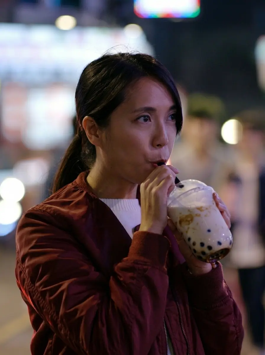 Guest enjoying a freshly made Pearl Lemon Boba bubble tea