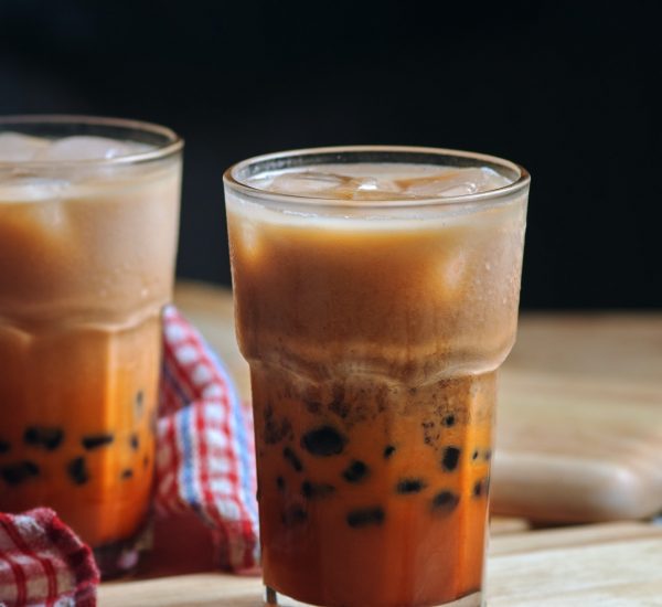 glass of bubble tea on wooden table